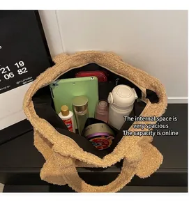 Top view of large plush tote bag showing spacious interior with tablet and daily essentials