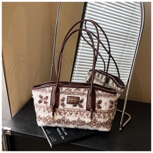 Detailed view of the vintage woolen tote bag featuring plush texture and brown leather handles