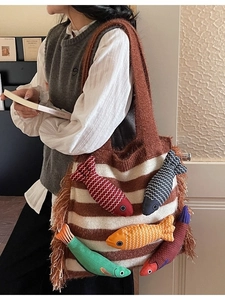 Knitted stripe tote bag with colorful 3D fish ornaments and side tassels decor