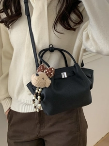 Black lychee leather bucket bag with silver buckle and cute teddy bear charm detail