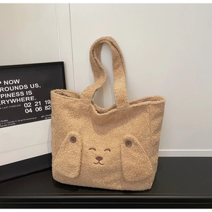 Detail of plush lamb wool tote bag showing cute dog embroidery and two ear-shaped pockets