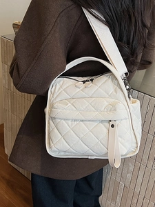 White quilted diamond stitch crossbody bag with wide strap for casual daily use