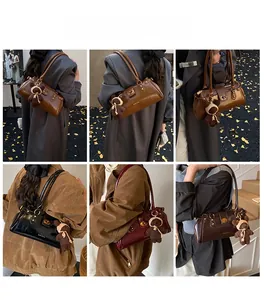 Detail view of retro leather shoulder bags in various colors with plush bear charm