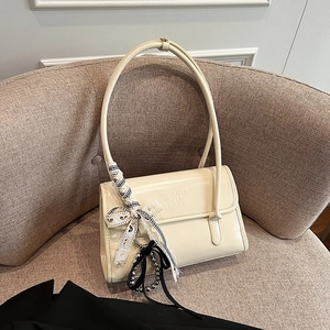 Chic cream white leather underarm bag with bow ribbon and silver bead pendant detail