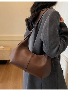 Brown litchi grain leather hobo shoulder bag styled with a grey tweed blazer
