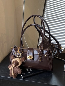 Retro chocolate brown glossy shoulder bag with gold hardware and cute bear charm