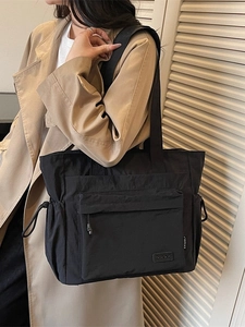 Large black nylon tote bag with D.K.A.P logo and side drawstrings for travel and gym