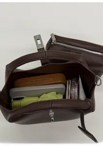 Top view showing large capacity interior of dark brown lychee leather bucket bag