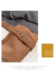 Detail of vintage brown tote bag showing soft PU leather and antique metal buckle closure
