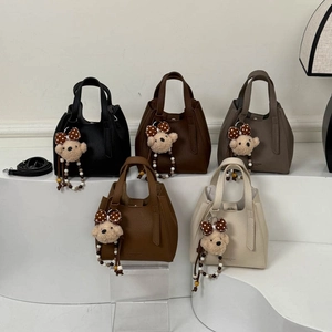 Litchi pattern leather bucket bags in five colors featuring cute plush bear charms