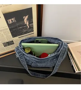 Interior view of large capacity denim tote bag showing spacious room for daily essentials