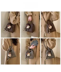 Detail of dark brown bucket bag with plush bear charm shown in multiple styling angles