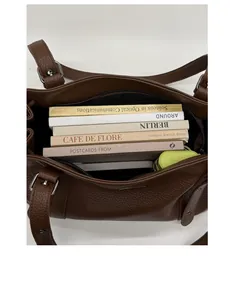 Spacious interior of dark brown litchi pattern tote bag showing daily items storage