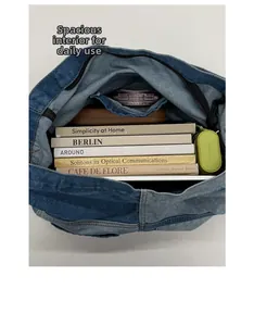 Internal view of a blue denim tote bag with zipper pocket and large capacity for daily use