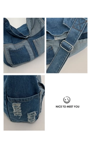Detail of denim patchwork tote showing frayed edges, pockets and adjustable metal buckle