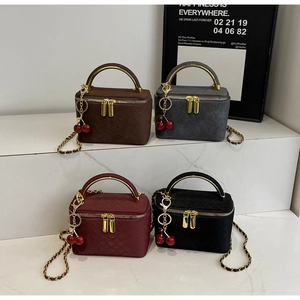 Detailed view of four retro quilted box bags in brown, grey, burgundy, and black finishes