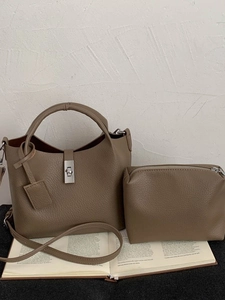 Two-piece khaki leather bucket bag set with top handles and adjustable shoulder strap