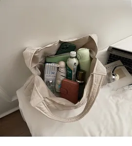Interior view of off-white quilted tote bag showing high capacity for daily essentials