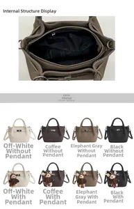 Detail of lychee pattern leather bucket bag showing metal lock and interior pocket