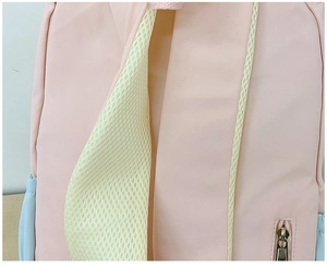Detail of pink macaron backpack featuring breathable honeycomb mesh back and zipper pocket
