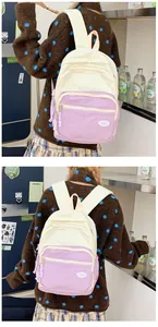 Detail of macaron color-block nylon backpack with adjustable straps for students