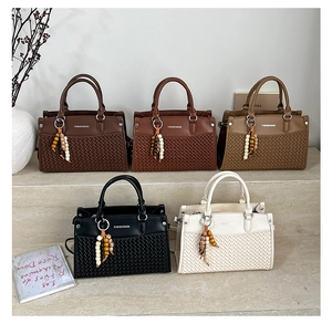 Detailed collection of woven texture handbags in five colors with beaded tassel charms