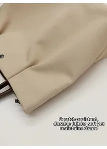 Close-up of durable twill canvas tote bag with reinforced leather handles and metal hardware