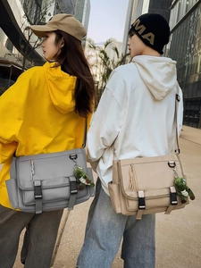 Water-resistant commuter messenger bag with large capacity and double buckle flap cover