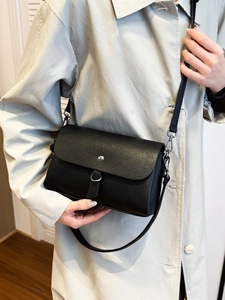 Classic black PU leather crossbody bag featuring a stylish rectangular box shape and flap