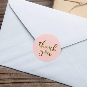 Pink and gold foil Thank You stickers on white envelope for weddings and gifts