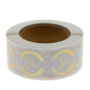Roll of gray and gold foil Thank You stickers with laurel wreath border for gift sealing