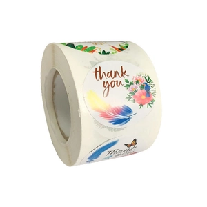 Roll of white Thank You stickers with feathers and flowers for gift packaging