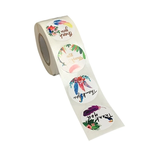Roll of circular Thank You stickers with four artistic floral and feather designs