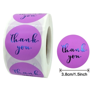 Purple and blue 1.5-inch Thank You stickers on a roll for gift box sealing