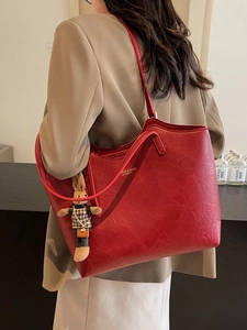 Large vintage red tote bag with textured faux leather and cute rabbit charm detail