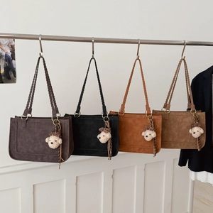 Vintage underarm tote bags with braided straps and plush bear charms in four colors