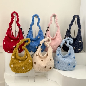 Collection of plush crescent shoulder bags in seven colors with star patterns and pleats