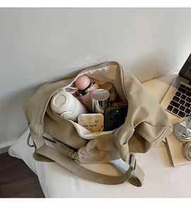 Interior view of large beige crossbody bag showing ample space for daily essentials