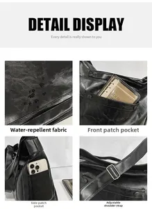Detail view of large black tote bag featuring water-repellent fabric and side pockets