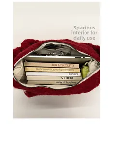 Detailed interior view of red plush tote bag showing large capacity for books and tablet