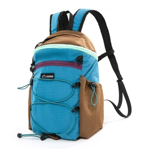 Detail view of water-resistant ripstop fabric and bungee cord on blue hiking backpack