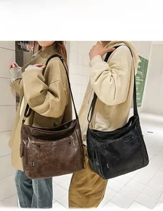 Detailed close-up of large capacity PU leather crossbody bags in brown and black colors