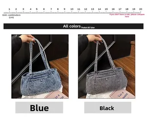 Detail of denim shoulder bags in blue and black colors showing the vintage washed texture