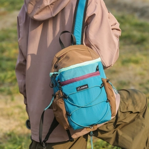 Detail of a lightweight waterproof foldable hiking backpack with bungee cord system