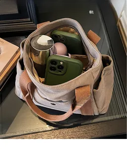 Top view of spacious canvas tote bag interior showing large capacity and side pockets