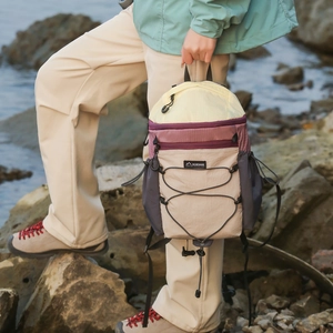 Outdoor detail of lightweight foldable backpack with color-blocking and bungee system