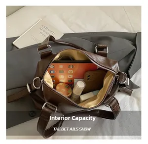Detailed view of the large interior capacity and light lining of the vintage tote bag