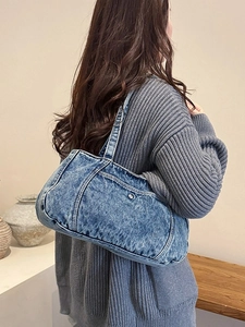 Minimalist blue washed denim crossbody shoulder bag with stylish metal rivet details