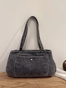 Minimalist grey washed denim tote bag with vintage metal button and contrast stitching