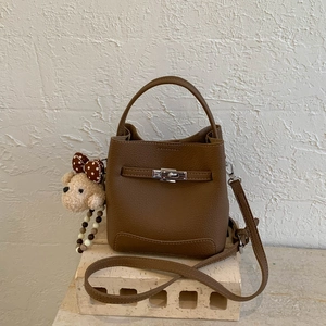 Brown lychee texture bucket bag with silver buckle and cute teddy bear charm